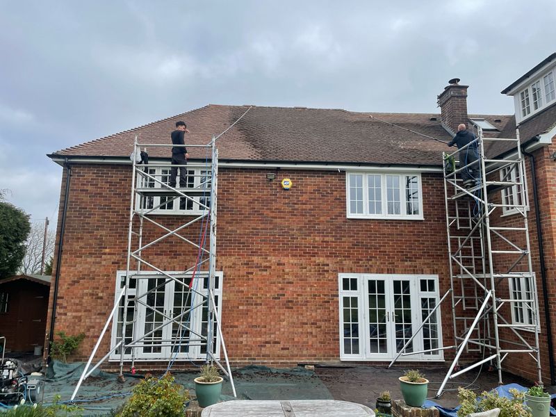 Roof cleaning carried out safely from scaffold towers by The Roof Moss Cleaners in Thatcham